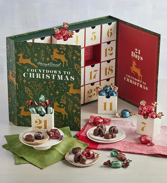 Deluxe advent calendar with Harry & David sweets and goodies surrounding it.