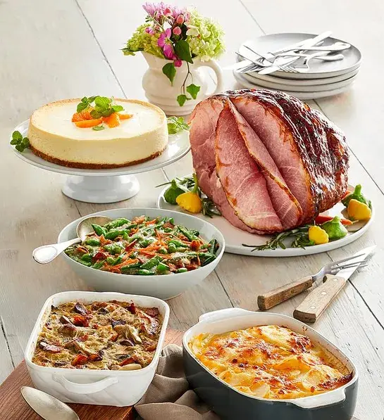 Can you fly with Thanksgiving food with a gourmet ham dinner on a table.