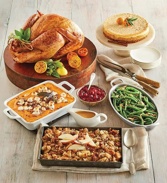 Can you fly with Thanksgiving food with a gourmet turkey meal on a table.