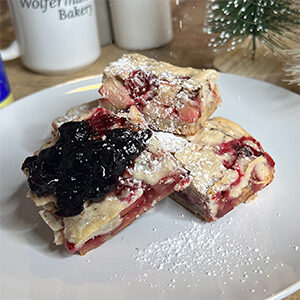 Christmas dinner ideas with a plate full of slices of breakfast cobbler.