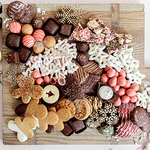 Christmas dinner ideas with a board of Christmas cookies.
