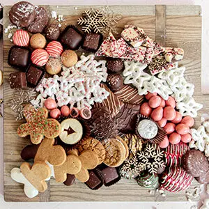 Christmas dinner ideas with a board of Christmas cookies.