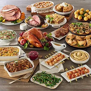 Christmas dinner ideas with a spread of Christmas food on a table.