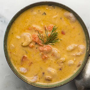 Christmas dinner ideas with a bowl of seafood bisque.