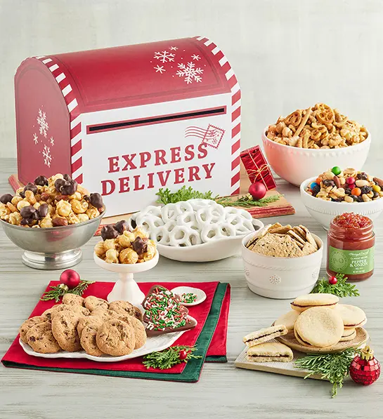 Christmas gift ideas for her with a box decorated like a Christmas mail box surrounded by sweet and savory treats.