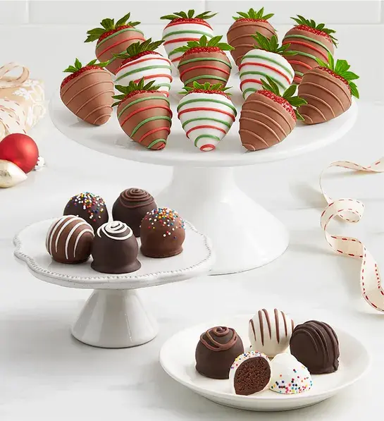 Gifts for coworkers with a plate of chocolate covered strawberries and truffles.