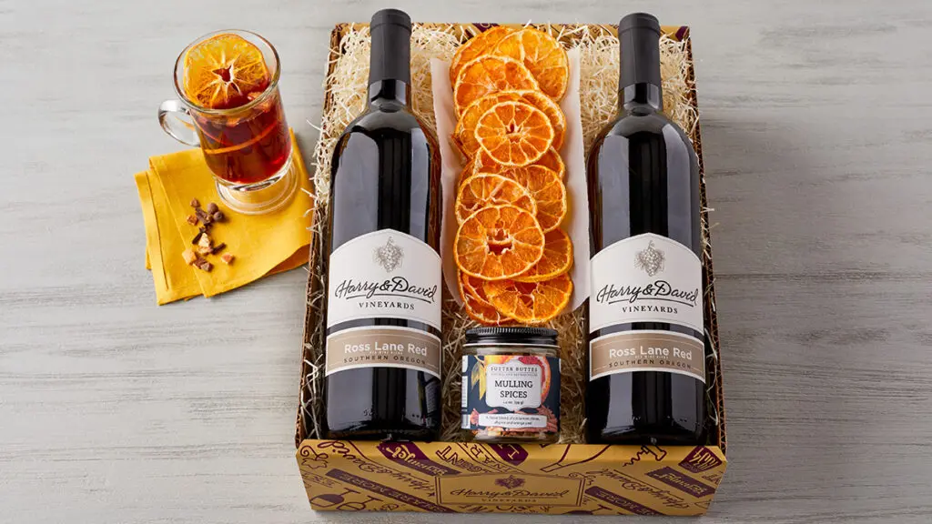 Mulled wine kit with dried fruit, two bottles of wine and mulled wine spices in a box.