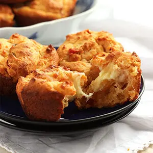 Pepper and onion relish cheesy biscuits on a plate.