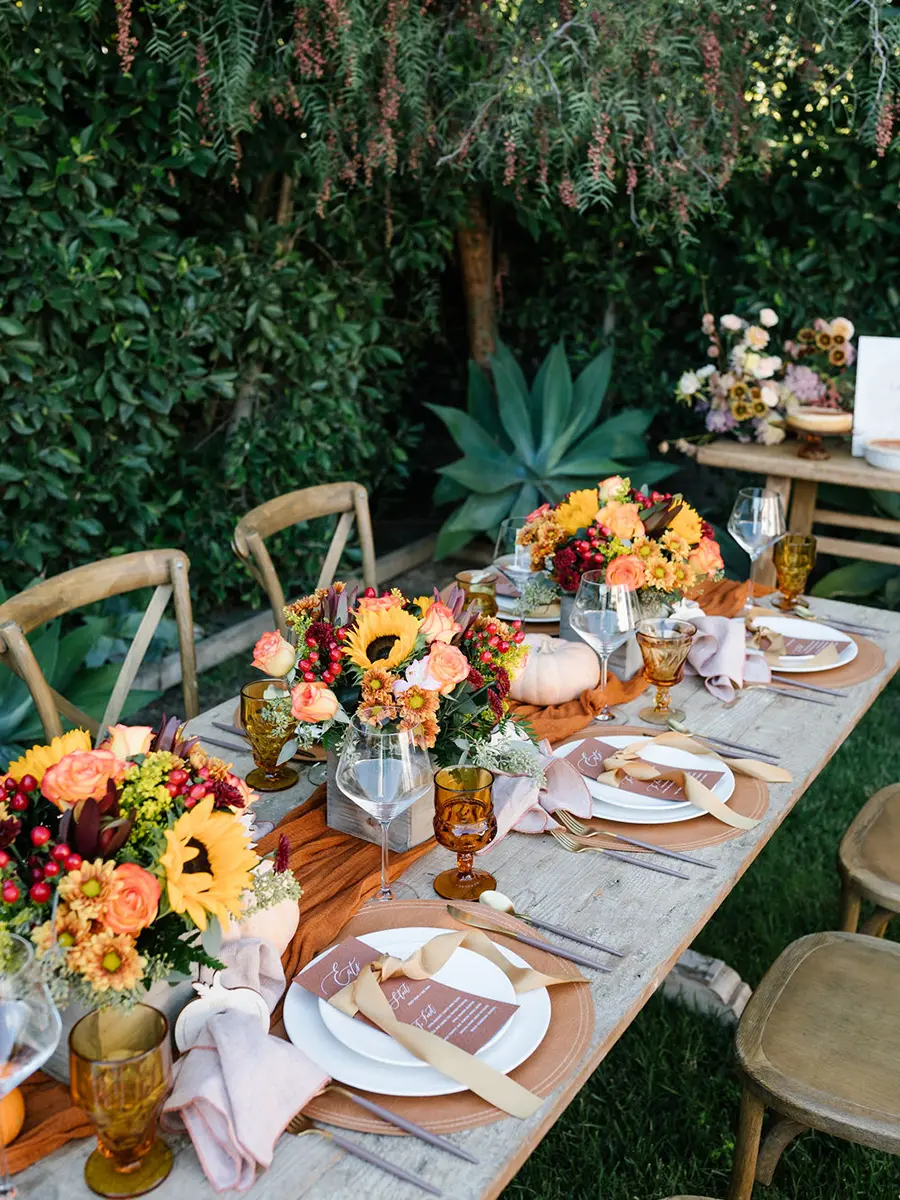 What is Friendsgiving with a table decorated and set for Friendsgiving.