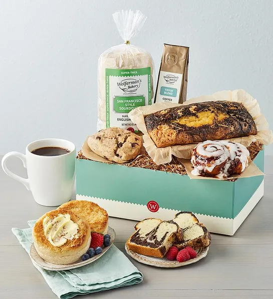 White elephant gift ideas with a box of baked goods next to a plate of English muffins.