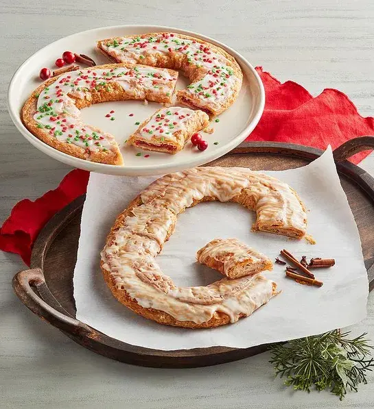 White elephant gift ideas with two plates of Christmas kringles.