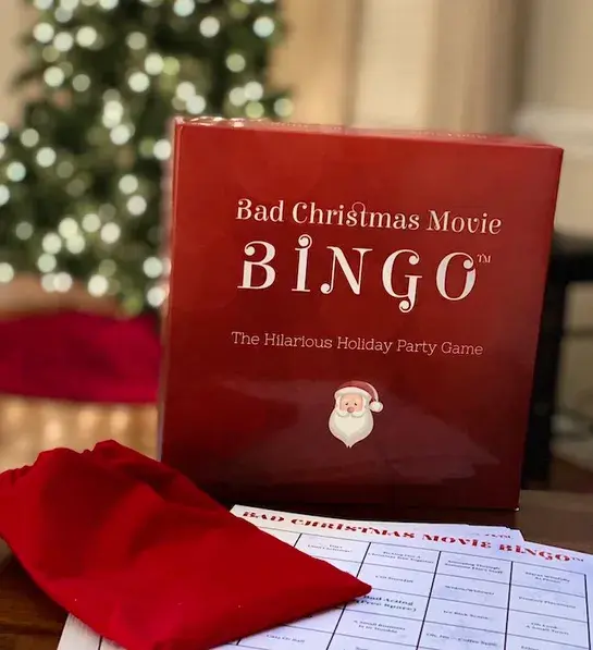 White elephant gift ideas with a box of bad Christmas movie bingo.