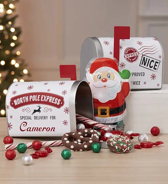 White elephant gift ideas with two personalized mail boxes surrounded by Christmas chocolate.