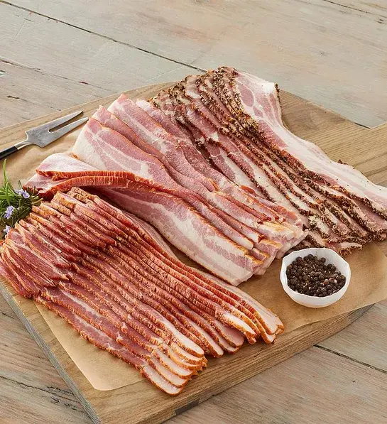 Best gifts for meat lovers with a cutting board with multiple kinds of bacon.