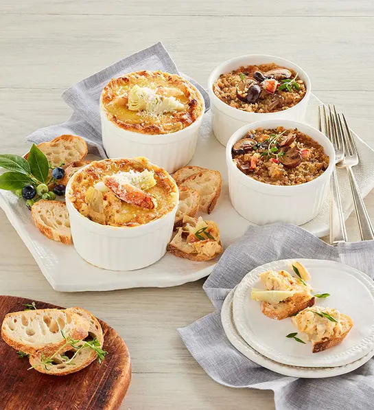 Seafood appetizers in small bowls.
