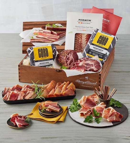 Best gifts for meat lovers with a crate of different kinds of charcuterie and cured meat.