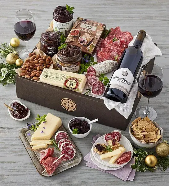 Best gifts with a wine pairing collection of cheese, meat and other snacks with two bottles of wine.