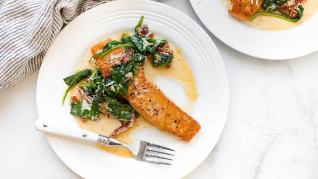 Cast iron salmon recipe on a plate.