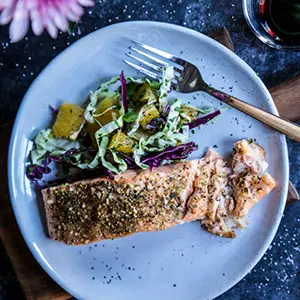 Salmon recipes with Cuban seasoned salmon on a plate with coleslaw.