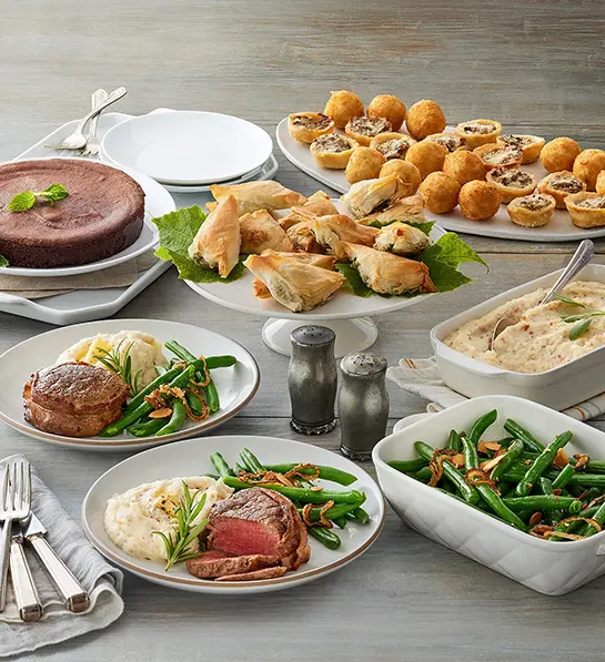 Valentine's Day gifts for him with a filet mignon dinner spread with entree, appetizers, and dessert.