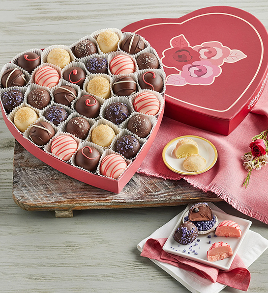 Valentine's Day gifts for her with a heart shaped box full of truffles.