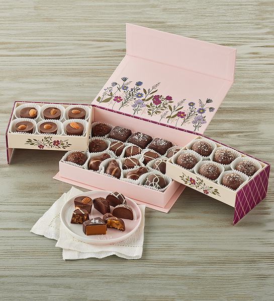 Valentine's Day gifts for her with a box of chocolates decorated with flowers.