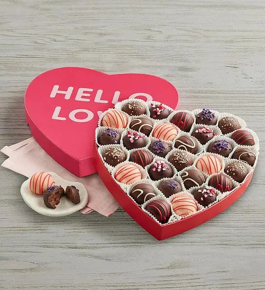 Valentine's Day gifts for her with a heart shaped box of truffles.