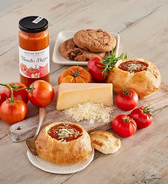 Tomato soup mix with bread bowls and ingredients.