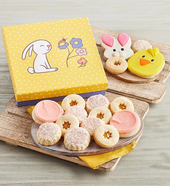 Easter basket stuffers with a box of Easter decorated cookies.