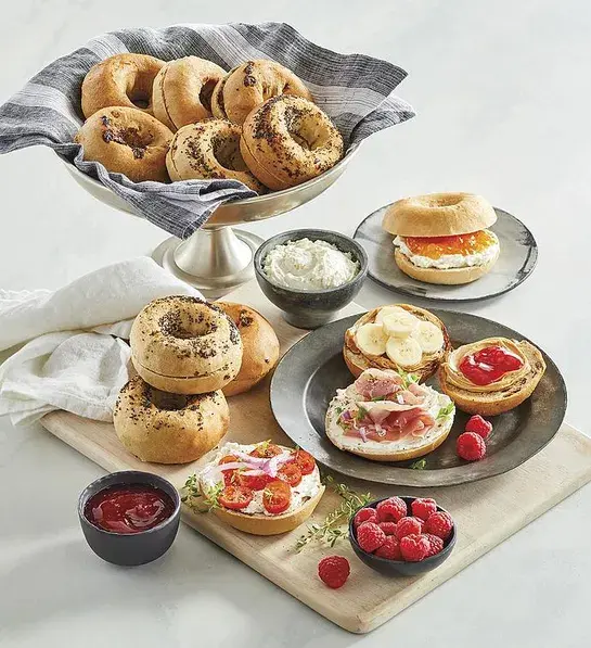 What is gluten with a basket of gluten free bagels and a plate of bagels covered with toppings.