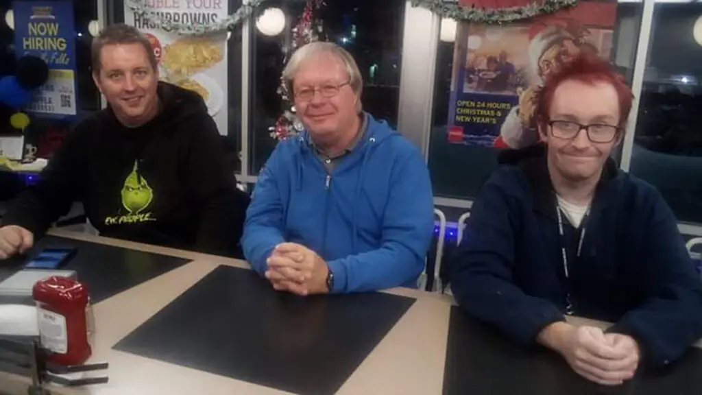 autistic care father and children at a restaurant.