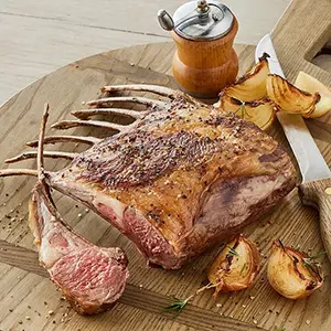 Easter brunch recipes with a rack of lamb on a cutting board.