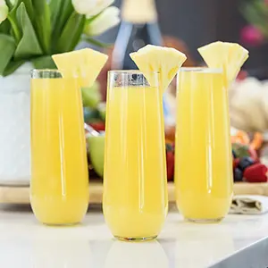 Easter brunch recipes with three glasses of pineapple mimosas.