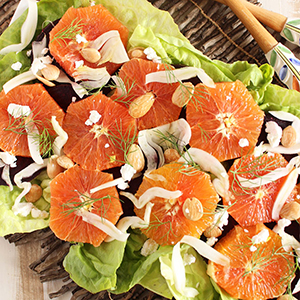 Mesclun fennel salad with sliced oranges on top.