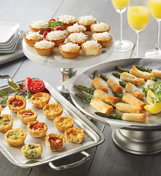 Quiche appetizers on platters.