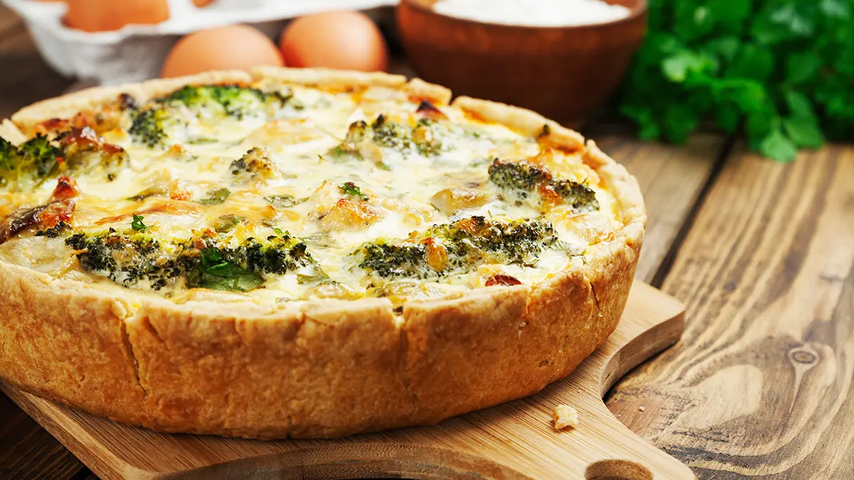 Quiche on a cutting board.