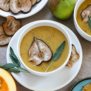 Spring vegetables pear soup in a bowl.