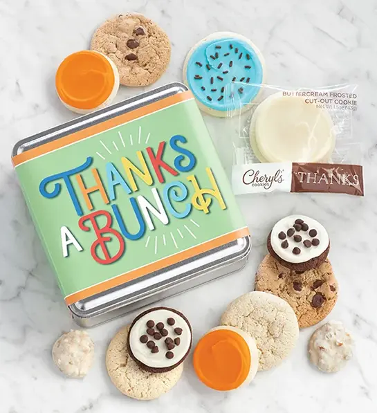Unique thank you gifts with a tin decorated with a thank you message surrounded by different types of cookies.