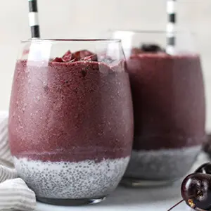 Cherry recipes with two cherry smoothies in short glasses.