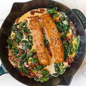 Cast-iron salmon recipe with spinach cream sauce.