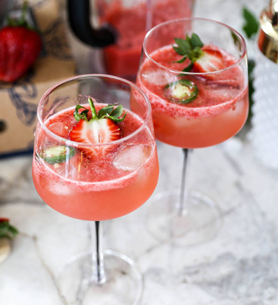 Types of strawberries in a cocktail.