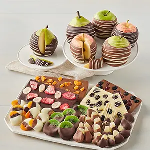 Belgian chocolate dipped fruit on platters.