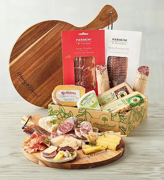 Favorite birthday gifts with a box of meat and cheese with crackers and other snacks.