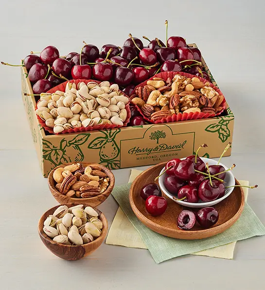 Types of cherries and a selection of nuts in a box.