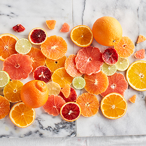 Slices of oranges on a marble counter top.
