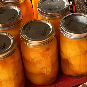 Peach recipes with several jars of canned peaches.