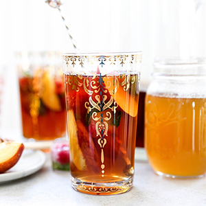 Peach recipes with peach iced tea in several glasses.