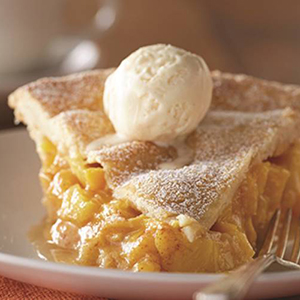 Peach recipes with a peach pie on a plate.