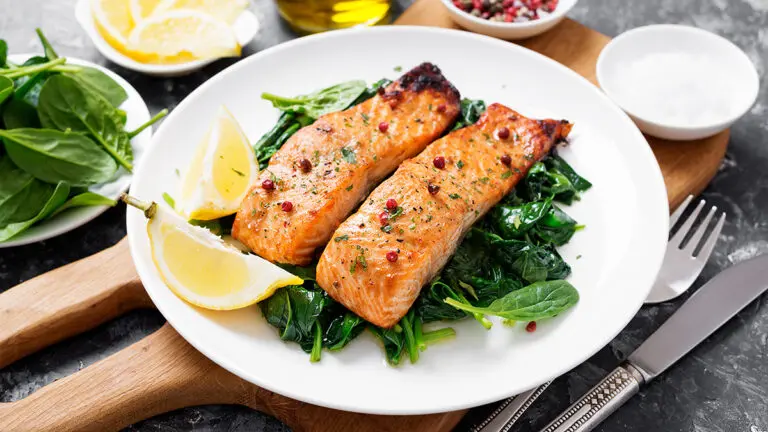 seafood and vegetable pairings with a plate of salmon on a bed of spinach.