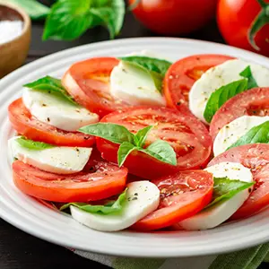 Caprese salad with tomatoes, mozzarella, and basil.